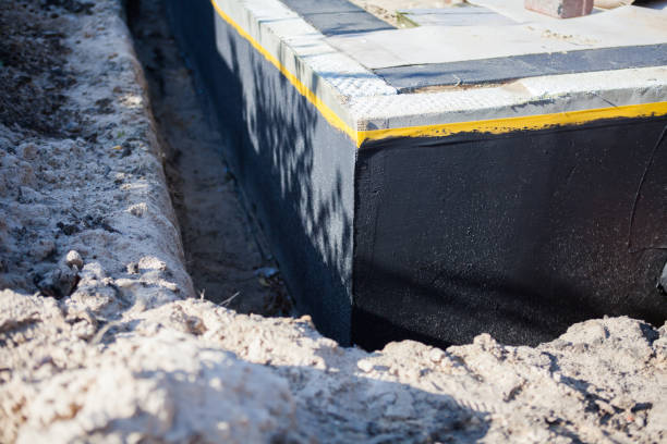 Professional Waterproofing technician working in Flora, IL